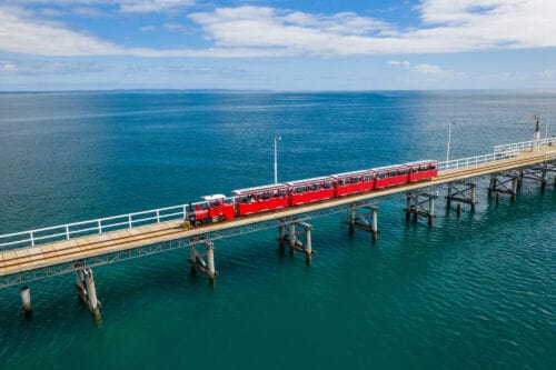 Aerial view of tourist train travelling along the Busselton Jetty