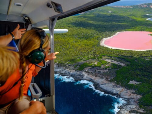 Couple on a scenic flight over Lake Hillier, Middle Island