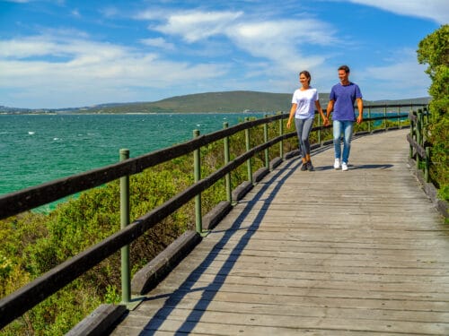 Couple walking on the Boardwalk at Middleton Beach, located in Albany